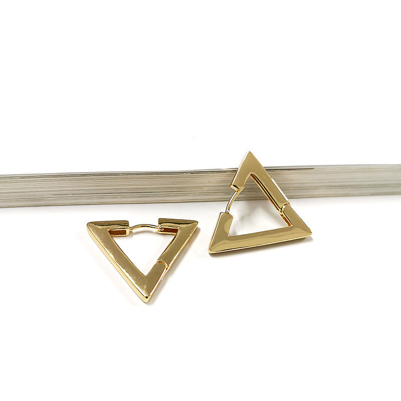 Gold colored geometric-shaped earrings