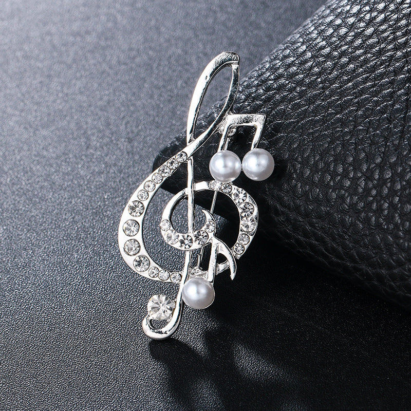 "Harmony Elegance Faux Diamond and Pearl Clef Brooch"