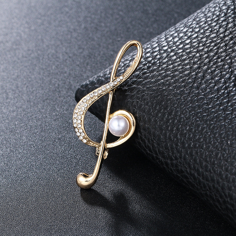 "Harmony Elegance Faux Diamond and Pearl Clef Brooch"