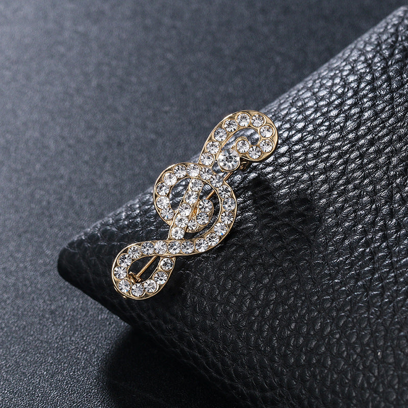 "Harmony Elegance Faux Diamond and Pearl Clef Brooch"