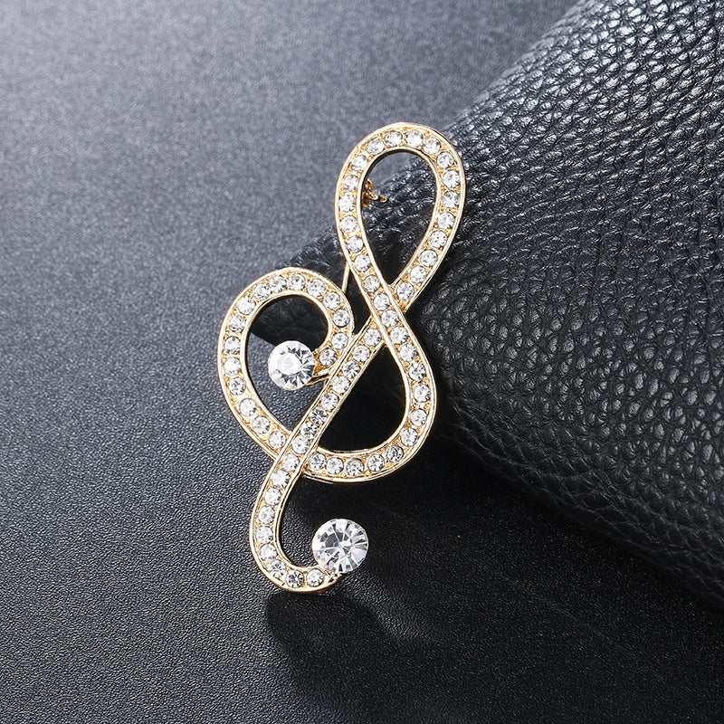 "Harmony Elegance Faux Diamond and Pearl Clef Brooch"