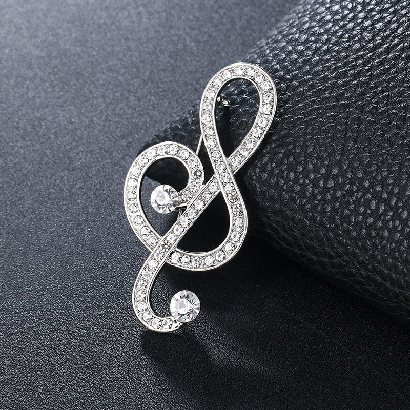 "Harmony Elegance Faux Diamond and Pearl Clef Brooch"